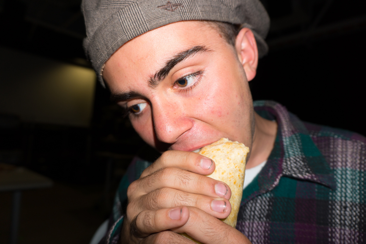 Teen Eating Burrito